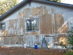 A house being prepared for paint by Speedy-Clean Painting & Pressure Washing.